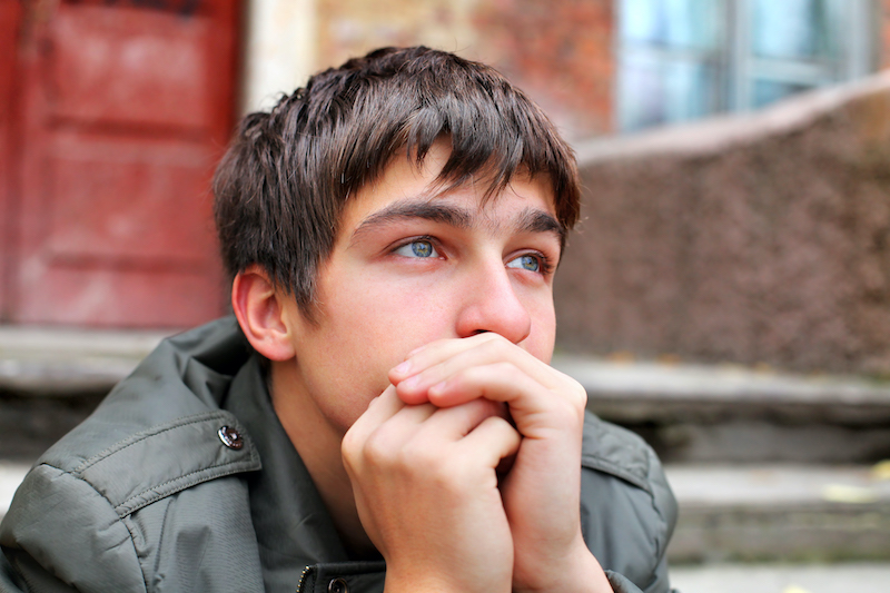 Teen sitting on steps Teen sitting on steps