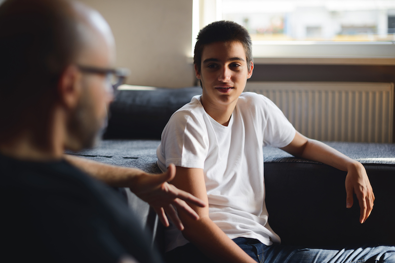 Teen talking to adult Teen talking to adult