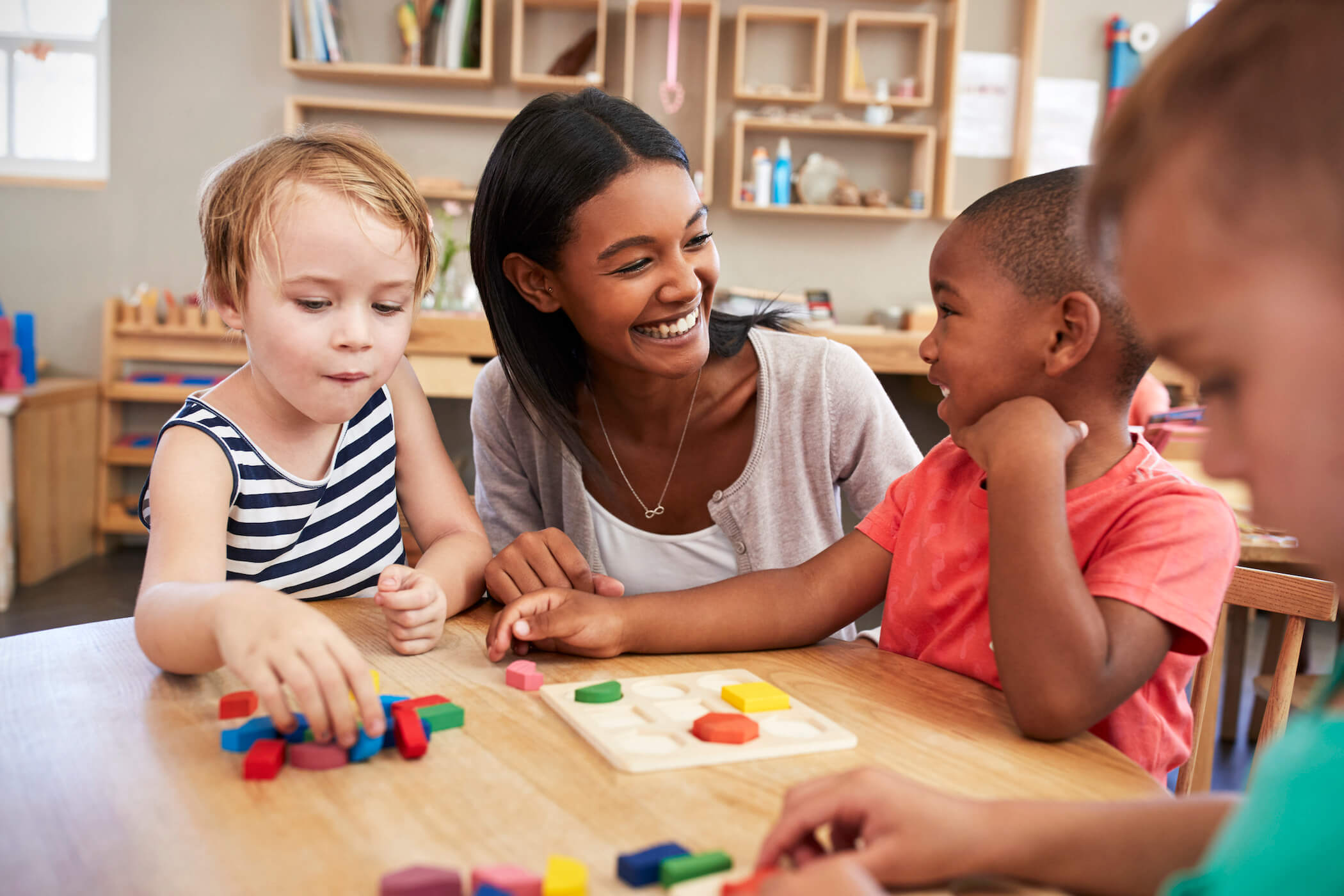 YMCA staff engages kids at child development center YMCA staff engages kids at child development center