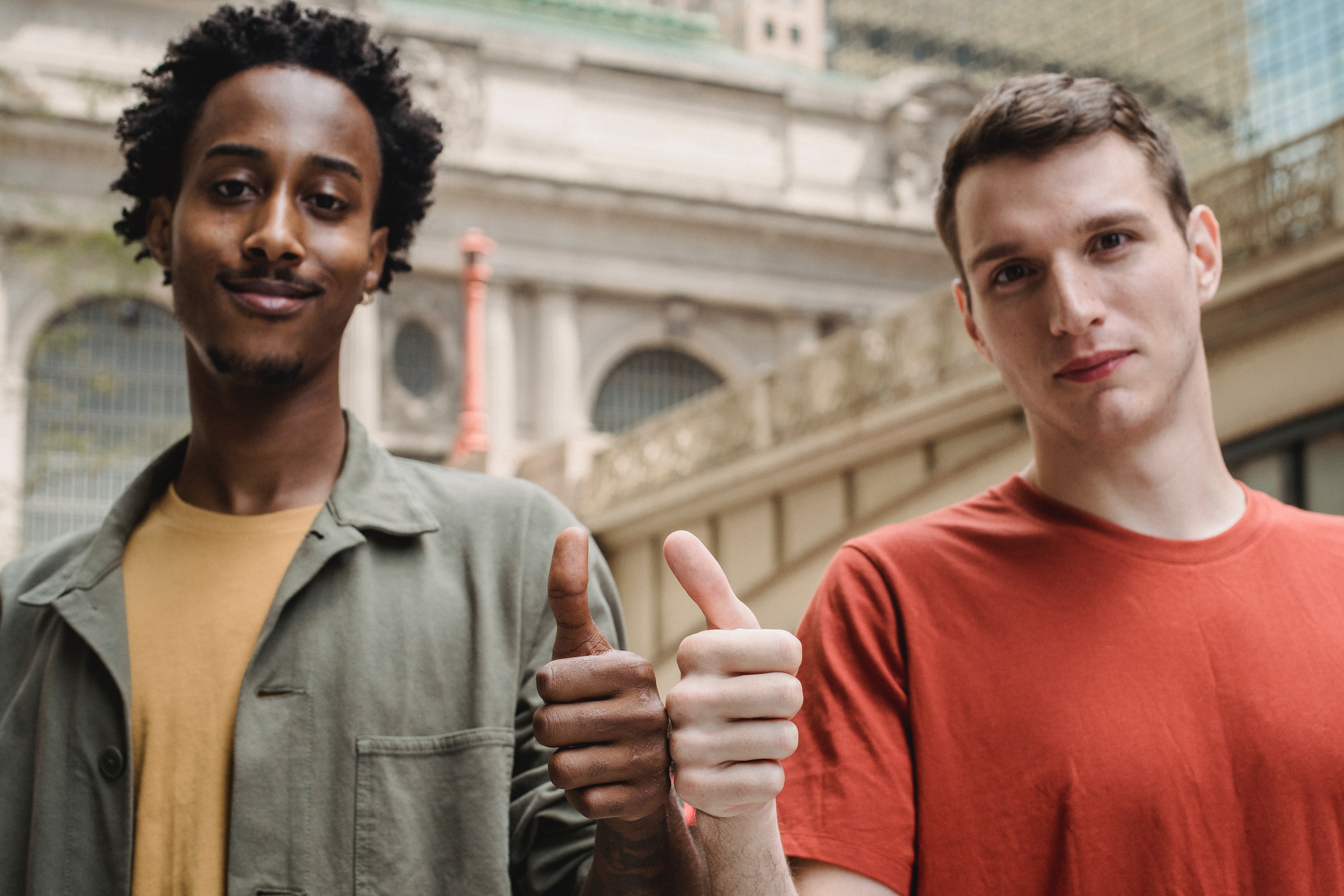 Two teens giving a thumbs up Two teens giving a thumbs up