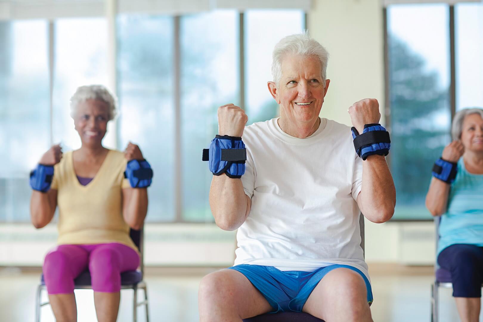 Older adults lifting weighted wrist bands at YMCA Louisville Older adults lifting weighted wrist bands at YMCA Louisville