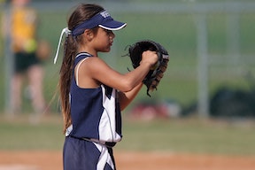 Kid playing in youth baseball game Kid playing in youth baseball game