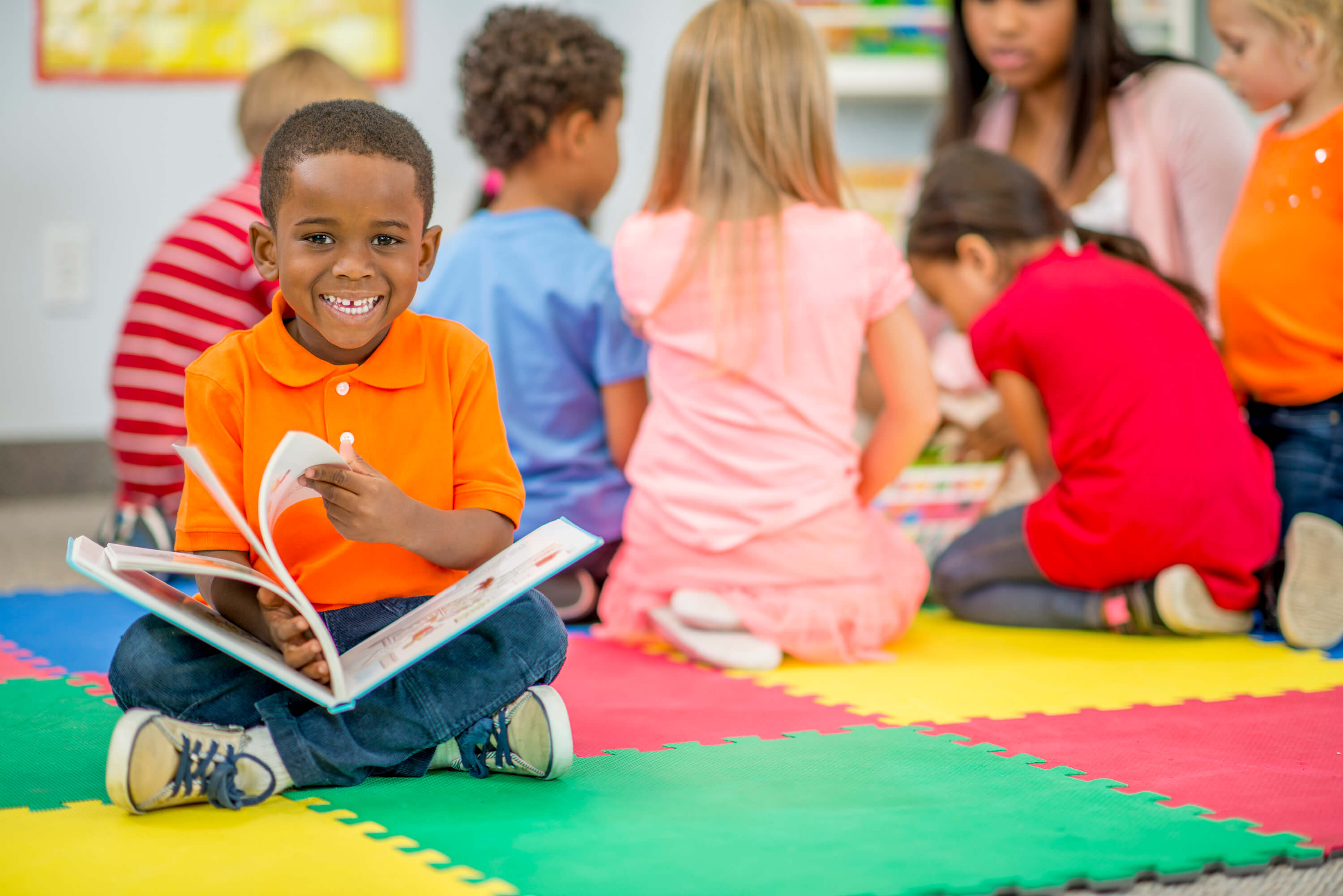 Child reading book at YMCA child development center Child reading book at YMCA child development center