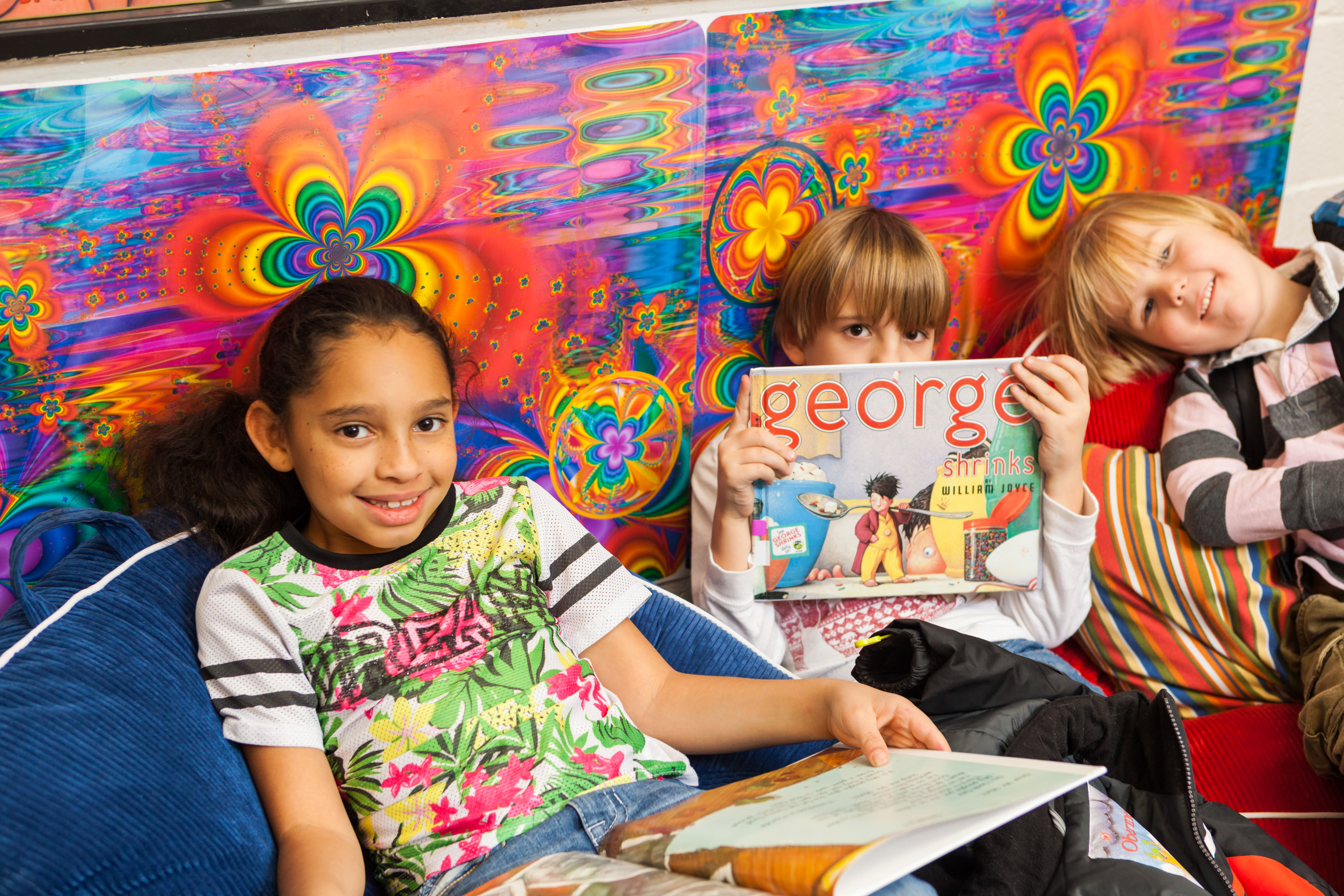 Kids in the reading room enjoying books Kids in the reading room enjoying books