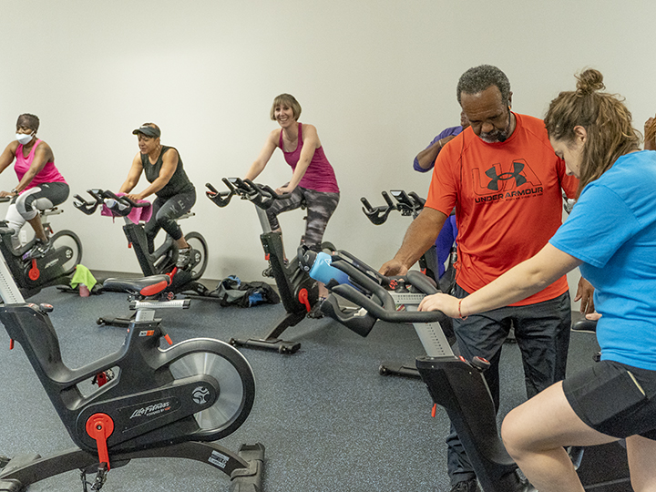 Group of people in a YMCA cycling class Group of people in a YMCA cycling class