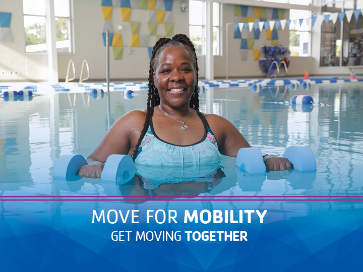 Woman in the pool for a water fitness class Woman in the pool for a water fitness class