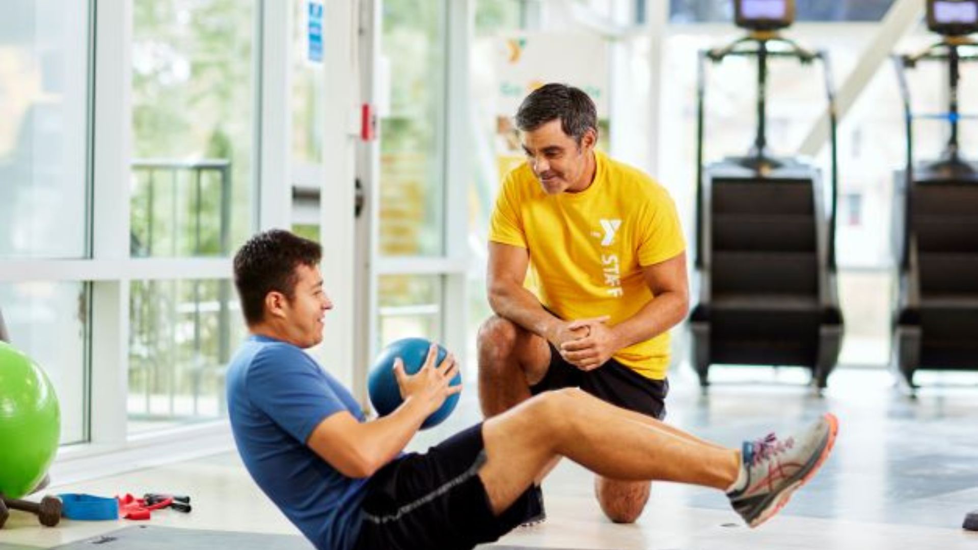 YMCA personal trainer working with a member YMCA personal trainer working with a member