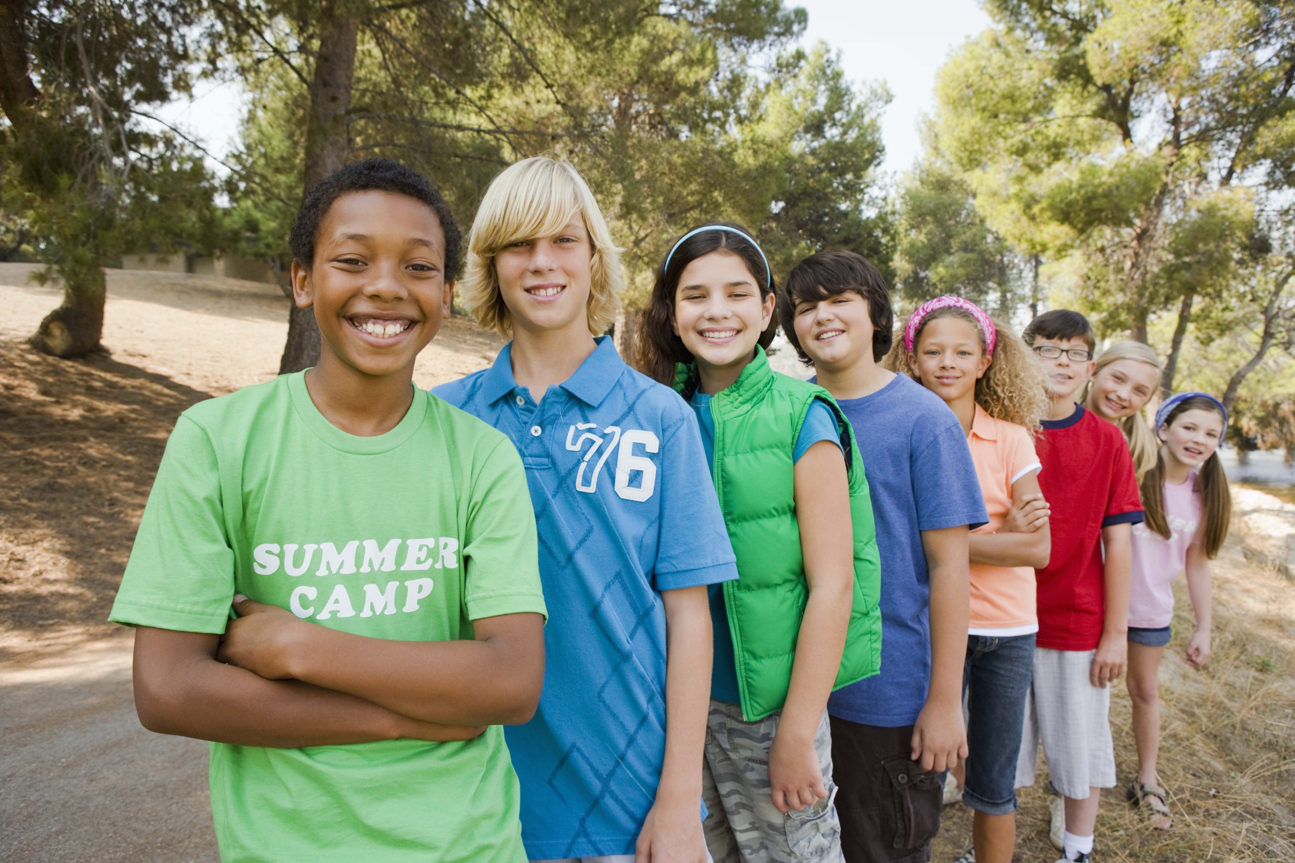 Group of teens standing next to each other Group of teens standing next to each other