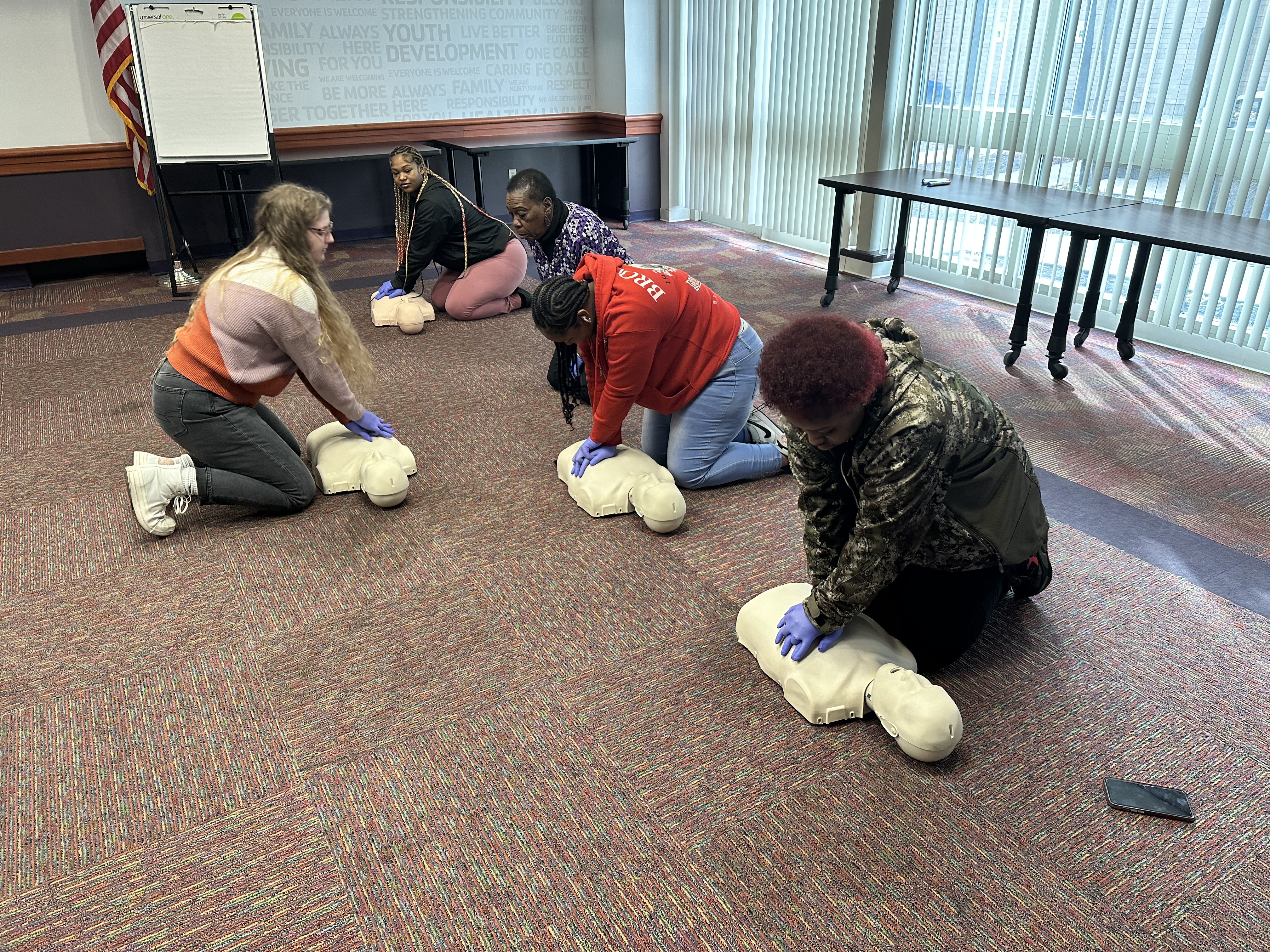 Person teaching a CPR class Person teaching a CPR class