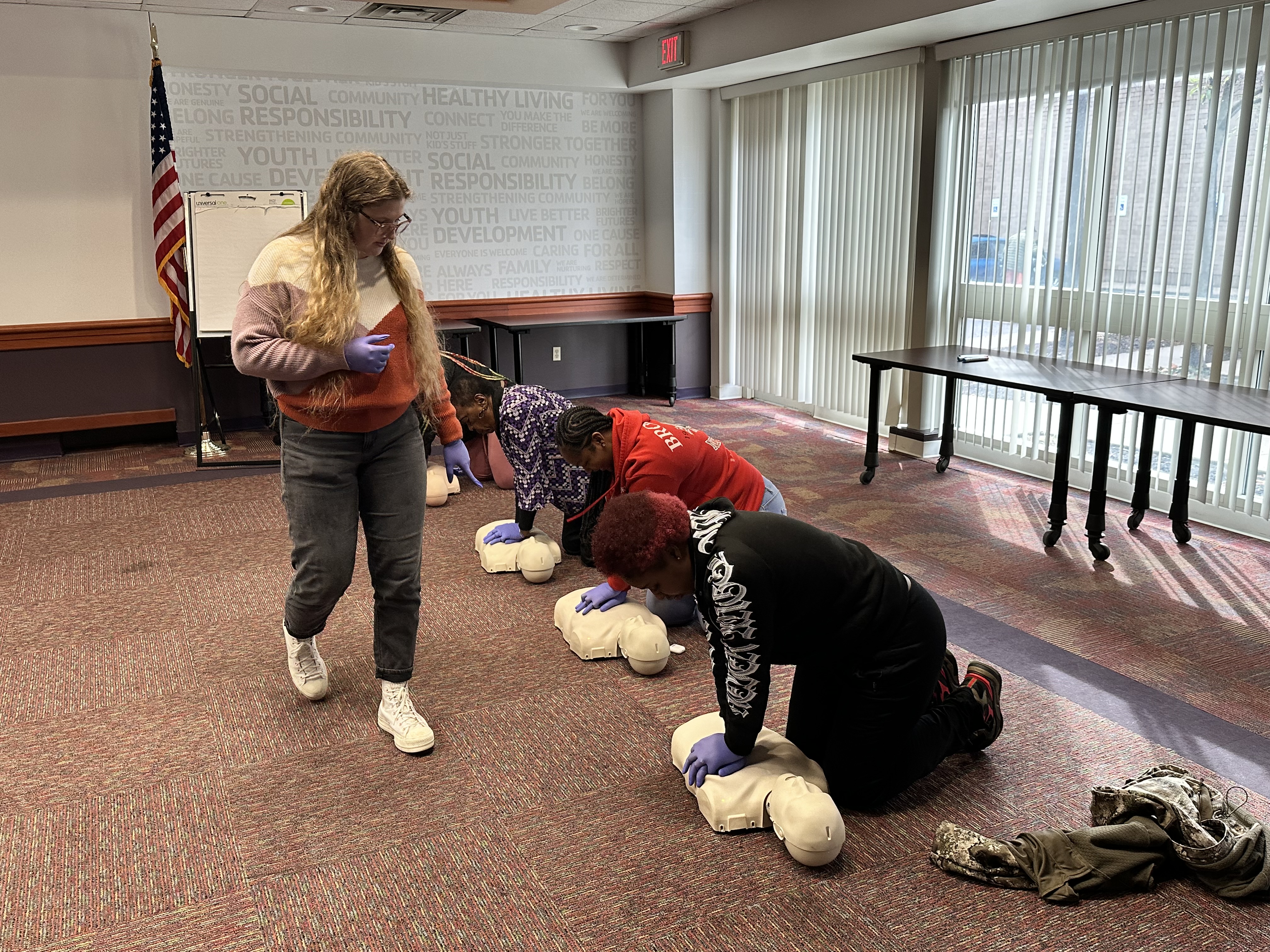 Person teaching a CPR class Person teaching a CPR class