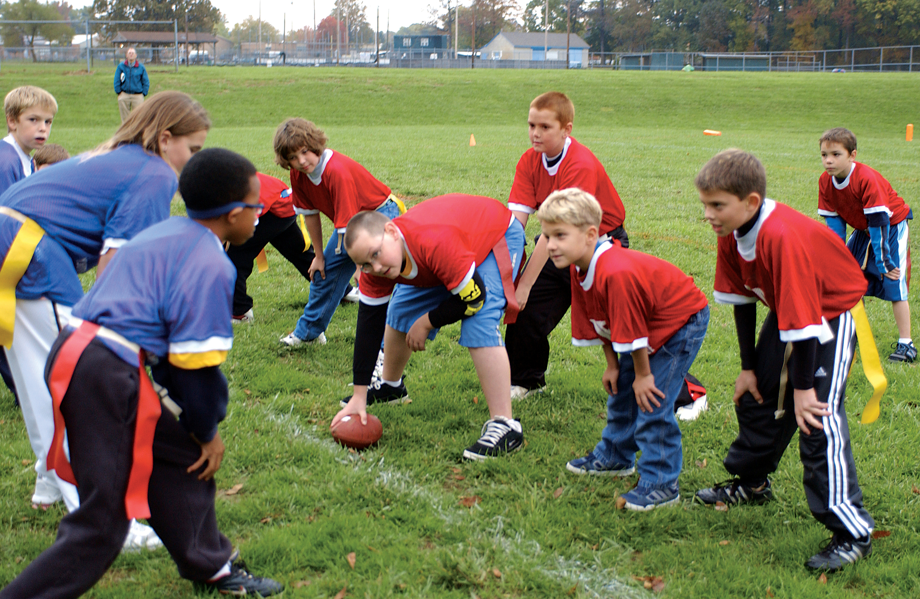 Group of children playing flag football Group of children playing flag football