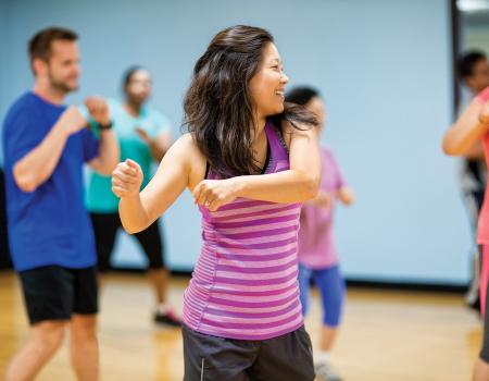 Adults dancing at group dance class at YMCA Louisville Adults dancing at group dance class at YMCA Louisville