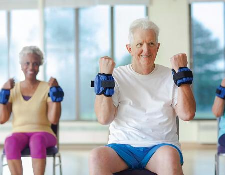 Older adults lifting weighted wrist bands at YMCA Louisville Older adults lifting weighted wrist bands at YMCA Louisville