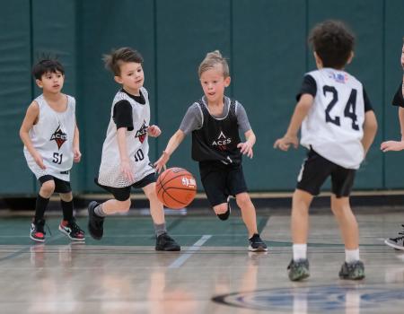 Kids playing basketball at the gym Kids playing basketball at the gym